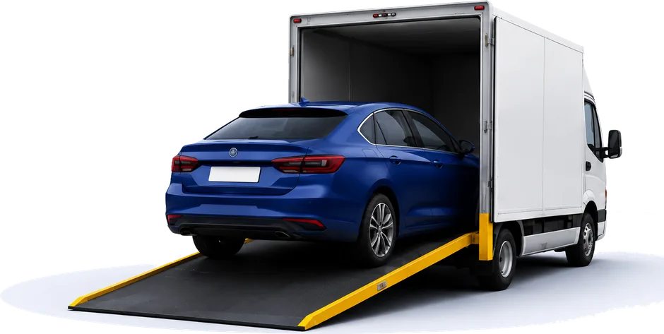 Car being loaded into a delivery truck